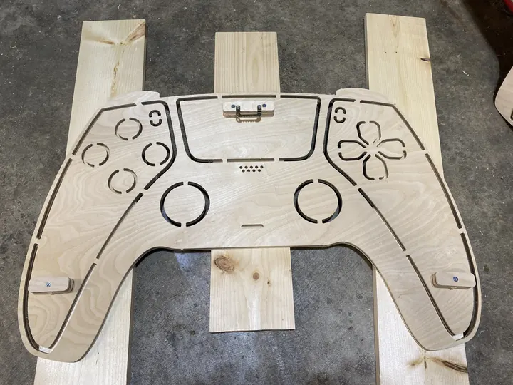 Parts of a controller sign laid out on the bed